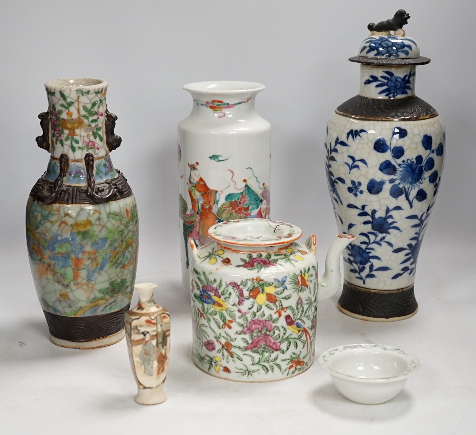 Three pairs of Chinese vases, a teapot, two bowls and a pair of miniature Satsuma vases, tallest item crackleware vases and covers 32cm high. Condition - poor